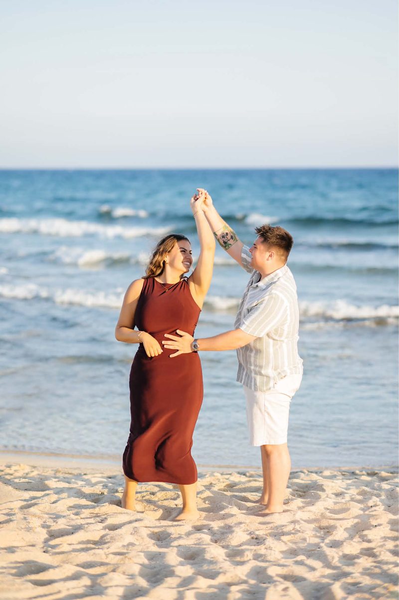 Liam and Andrea dancing on the sand